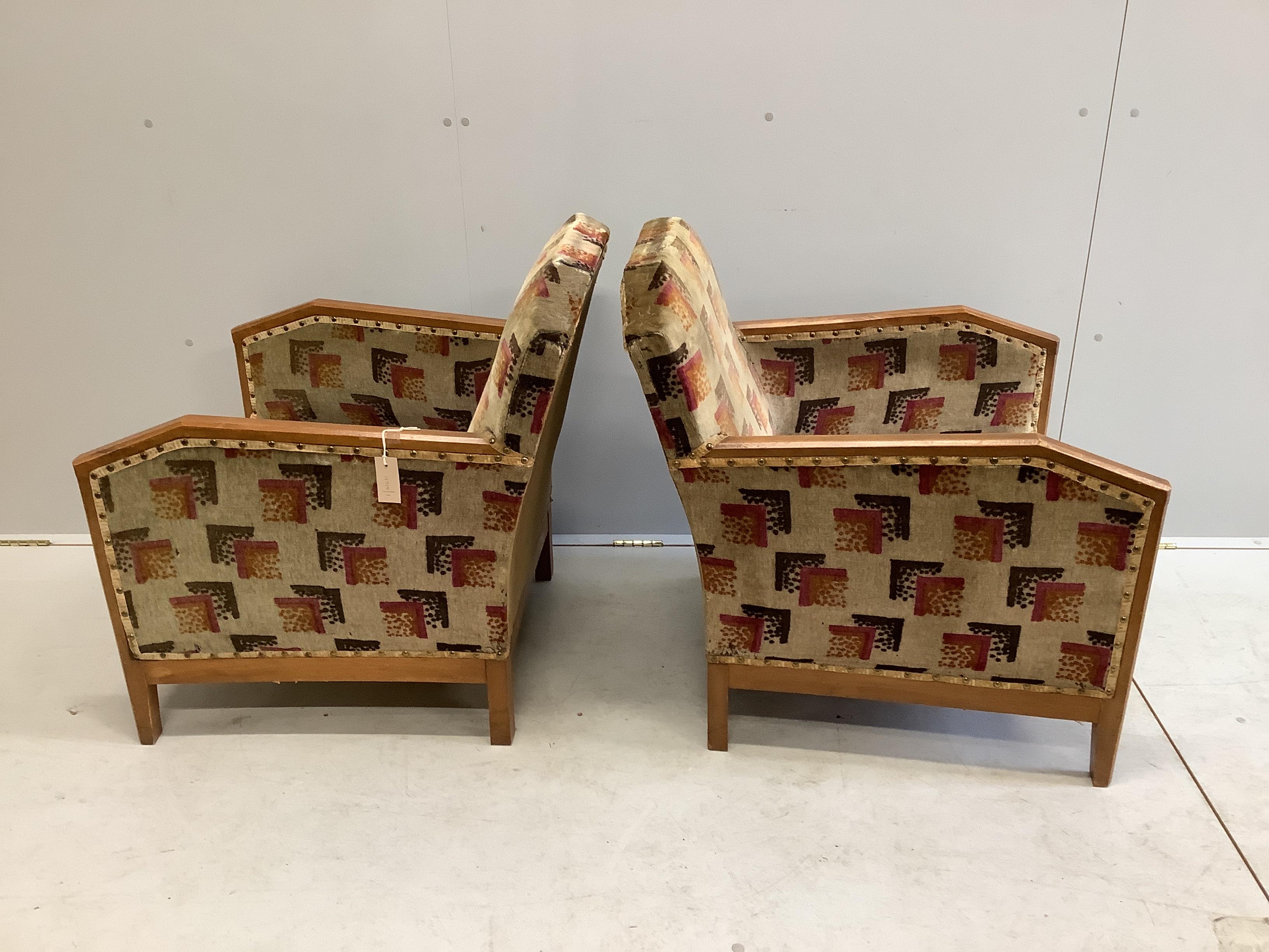 A pair of French Art Deco upholstered beech armchairs, width 62cm, depth 68cm, height 76cm